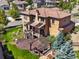 Aerial view of the backyard with a patio, pergola, and beautifully landscaped yard at 2256 S Isabell Ct, Lakewood, CO 80228