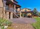 Beautiful backyard with a stamped concrete patio, pergola covered seating area, and manicured landscaping at 2256 S Isabell Ct, Lakewood, CO 80228