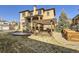 Backyard featuring covered patio, wood pergola and tiered garden at 2256 S Isabell Ct, Lakewood, CO 80228