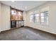 Cozy room featuring a rustic bar area with wooden accents, mini-fridges, and bright lighting at 2256 S Isabell Ct, Lakewood, CO 80228