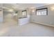 Finished basement with large windows, carpeting, and recessed lighting at 2256 S Isabell Ct, Lakewood, CO 80228