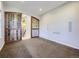 The bonus room showcases barn doors and carpeted flooring, offering a versatile space for your lifestyle at 2256 S Isabell Ct, Lakewood, CO 80228