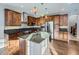 Spacious kitchen with stainless steel appliances, an island, pendant lighting, and hardwood floors at 2256 S Isabell Ct, Lakewood, CO 80228