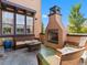 Inviting outdoor space with a fireplace, comfortable seating, and stylish decor at 2256 S Isabell Ct, Lakewood, CO 80228