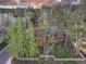 Aerial view of the home on a spacious lot with mature trees and a charming fenced yard at 102 S High St, Breckenridge, CO 80424