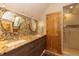 Bright bathroom featuring a double sink, walk-in shower, and lots of natural light at 102 S High St, Breckenridge, CO 80424