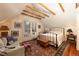 Cozy bedroom featuring a decorative rug, wooden beams, and lots of natural light at 102 S High St, Breckenridge, CO 80424