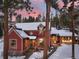 Charming red home with snow-covered roof and landscape, adjacent guest house, and a colorful sunset at 102 S High St, Breckenridge, CO 80424