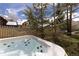 Relax in this home's private hot tub with views of the serene backyard and surrounding neighborhood at 102 S High St, Breckenridge, CO 80424