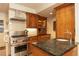 Well-appointed kitchen featuring custom wood cabinetry, stainless steel appliances, and a center island at 102 S High St, Breckenridge, CO 80424
