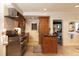 Gourmet kitchen featuring stainless steel appliances, custom wood cabinets, and a convenient center island at 102 S High St, Breckenridge, CO 80424