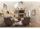 Bright living room featuring a stone fireplace, vaulted ceiling, skylight, and comfortable seating at 102 S High St, Breckenridge, CO 80424