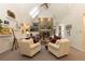 Spacious living area featuring a stone fireplace, skylight, and comfortable seating arrangements at 102 S High St, Breckenridge, CO 80424