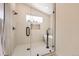 Sleek bathroom with a glass enclosed shower, soaking tub, and modern fixtures at 1298 Silverheels Dr, Larkspur, CO 80118