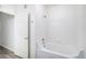Bright bathroom features a shower over a tub and is decorated in white at 452 Black Feather Loop # 606, Castle Rock, CO 80104
