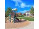 Vibrant community playground with slide, steps, and charming clubhouse for outdoor fun and recreation at 452 Black Feather Loop # 606, Castle Rock, CO 80104