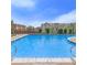 Community pool with pristine blue water, pergola, deck, and seating area for relaxation and enjoyment at 452 Black Feather Loop # 606, Castle Rock, CO 80104