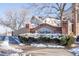 Elegant brick entrance sign for Quail Run community, surrounded by greenery and a quaint fence at 1128 S Ventura Cir # B, Aurora, CO 80017