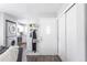 Inviting foyer with coat rack and a glimpse into the living room and kitchen at 1128 S Ventura Cir # B, Aurora, CO 80017