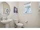 Clean bathroom with pedestal sink and updated fixtures at 1123 Williams Loop, Elizabeth, CO 80107