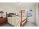 Bedroom with wooden post bed and window at 1123 Williams Loop, Elizabeth, CO 80107