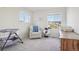 Bedroom with bassinet, recliner, and dresser at 1123 Williams Loop, Elizabeth, CO 80107