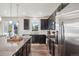 Spacious kitchen featuring granite island and dark cabinetry at 1123 Williams Loop, Elizabeth, CO 80107