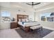 Spacious main bedroom with ceiling fan and large windows at 1123 Williams Loop, Elizabeth, CO 80107