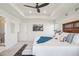 Bright main bedroom featuring a large bed and ensuite bathroom at 1123 Williams Loop, Elizabeth, CO 80107