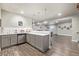 This open basement bar features ample counter space, bar seating, a sink, and a dishwasher at 11884 Barrentine Loop, Parker, CO 80138