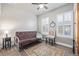 Spare bedroom decorated with a futon, chair, and a beautiful area rug at 11884 Barrentine Loop, Parker, CO 80138