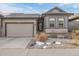 Charming home featuring a well-manicured front yard and an attached garage at 11884 Barrentine Loop, Parker, CO 80138