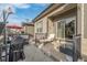 Enjoyable patio area with grill, chaise lounge, red umbrella, and easy access to the home at 11884 Barrentine Loop, Parker, CO 80138