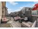 Inviting patio area with comfortable seating around a fire pit and stylish decorative screen panels at 11884 Barrentine Loop, Parker, CO 80138