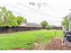 Spacious backyard with lush lawn and mature trees at 134 S 5Th Ave, Brighton, CO 80601
