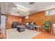 Finished basement with wood paneling, hardwood floors, recessed lighting and a cozy seating area at 134 S 5Th Ave, Brighton, CO 80601