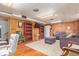 Finished basement with wood paneling, hardwood floors, recessed lighting and a cozy seating area at 134 S 5Th Ave, Brighton, CO 80601