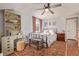 Bedroom featuring a bed, chest, desk, and a window with natural light at 134 S 5Th Ave, Brighton, CO 80601