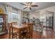 Charming dining area connected to the kitchen, featuring a wooden table and bar stool seating at 134 S 5Th Ave, Brighton, CO 80601