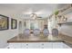 Spacious kitchen with an eat-in island, complete with marble countertops, seating, and stylish accents at 134 S 5Th Ave, Brighton, CO 80601