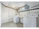 Functional laundry room with washer, dryer, and utility sink at 134 S 5Th Ave, Brighton, CO 80601