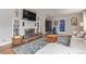 Comfortable living room featuring a fireplace, built-in shelving, and a cozy seating area at 134 S 5Th Ave, Brighton, CO 80601