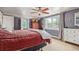 Spacious main bedroom with hardwood floors, a ceiling fan, and large windows for plenty of natural light at 134 S 5Th Ave, Brighton, CO 80601