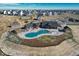 Aerial view of community pool, clubhouse, and surrounding landscape at 1143 Williams Loop, Elizabeth, CO 80107