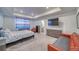 Spacious bedroom with a comfy bed, dresser, and seating area at 1143 Williams Loop, Elizabeth, CO 80107