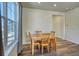 Bright dining area with wood floor and a table for four at 1143 Williams Loop, Elizabeth, CO 80107