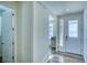 Bright entryway with hardwood floors and access to powder room at 1143 Williams Loop, Elizabeth, CO 80107