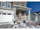 Covered porch with stone accents and white railing at 1143 Williams Loop, Elizabeth, CO 80107