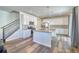 Modern kitchen with white cabinets, granite island, and stainless steel appliances at 1143 Williams Loop, Elizabeth, CO 80107