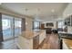 Open kitchen with granite island and deck access at 1143 Williams Loop, Elizabeth, CO 80107